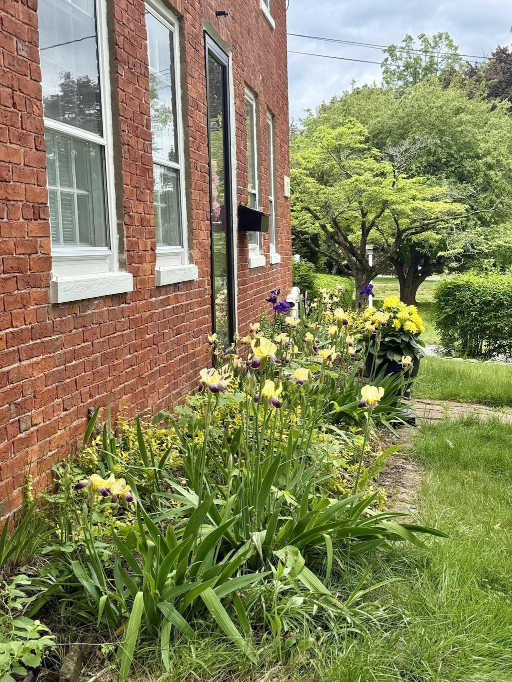 517 Wolcott Hill Rd, Wethersfield, CT 06109 - view of home's exterior featuring brick siding