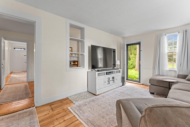 517 Wolcott Hill Rd, Wethersfield, CT 06109 - living area with light wood-style floors and baseboards