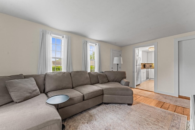 517 Wolcott Hill Rd, Wethersfield, CT 06109 - living room with light wood finished floors and baseboards