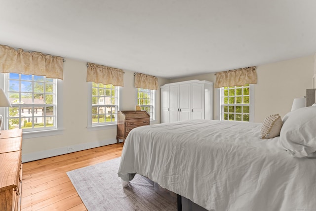 517 Wolcott Hill Rd, Wethersfield, CT 06109 - bedroom featuring wood-type flooring and baseboards