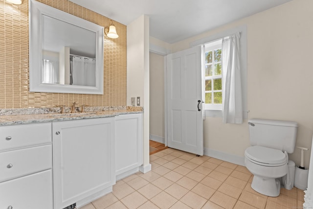 517 Wolcott Hill Rd, Wethersfield, CT 06109 - bathroom with vanity, tile patterned floors, toilet, and baseboards