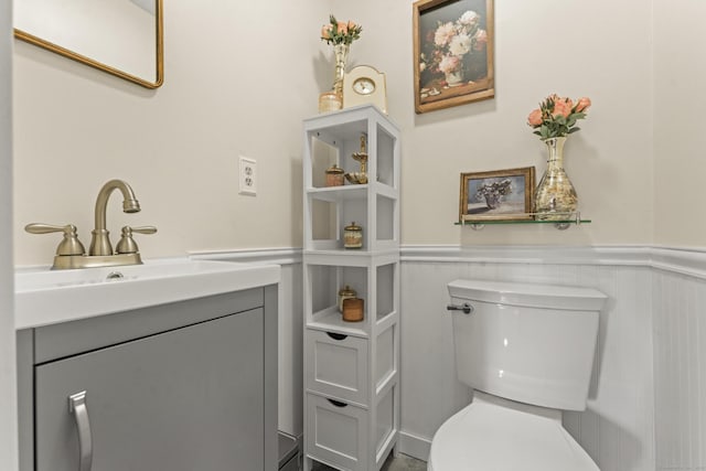517 Wolcott Hill Rd, Wethersfield, CT 06109 - bathroom featuring wainscoting, toilet, and vanity