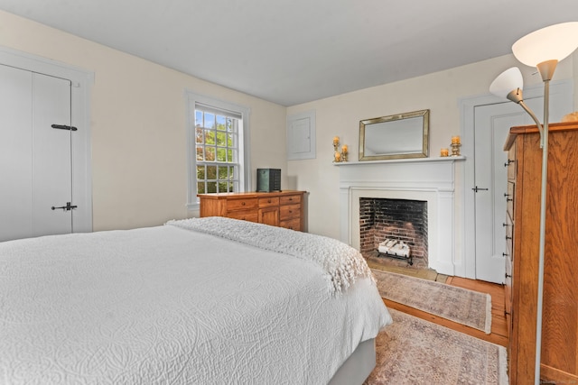 517 Wolcott Hill Rd, Wethersfield, CT 06109 - bedroom featuring wood finished floors and a fireplace