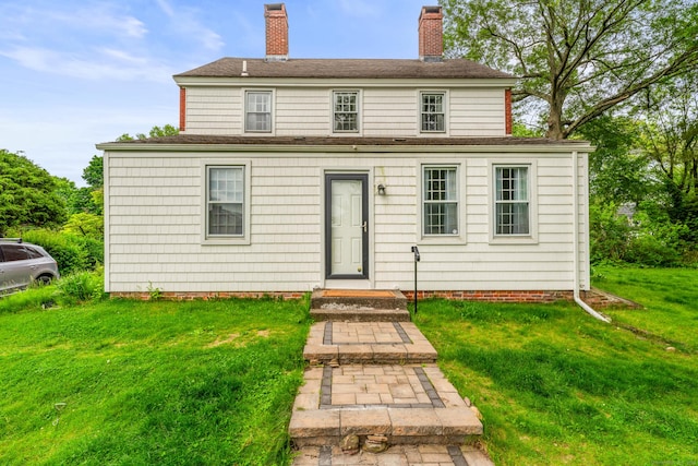 517 Wolcott Hill Rd, Wethersfield, CT 06109 - view of front of house featuring a chimney, a front yard, and a shingled roof