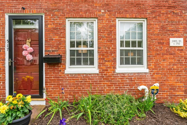 517 Wolcott Hill Rd, Wethersfield, CT 06109 - view of exterior entry featuring brick siding