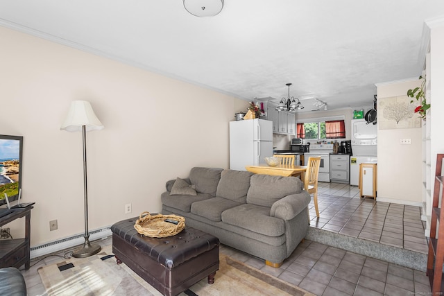 32 Anton Rd Apt C, Mansfield, CT 06268 - living room featuring a chandelier, crown molding, baseboard heating, and light tile patterned floors