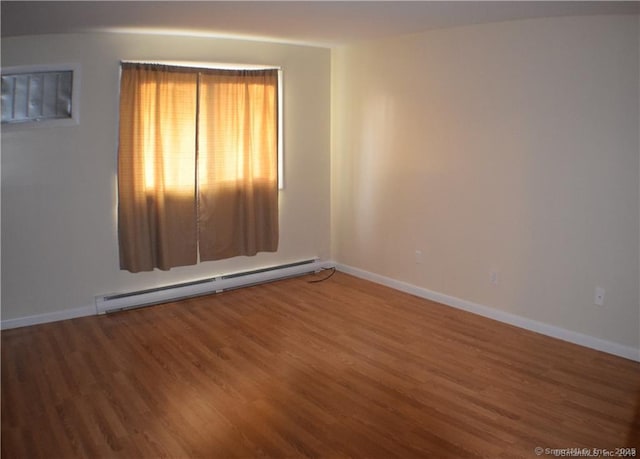32 Anton Rd Apt C, Mansfield, CT 06268 - spare room featuring baseboard heating, wood finished floors, and baseboards