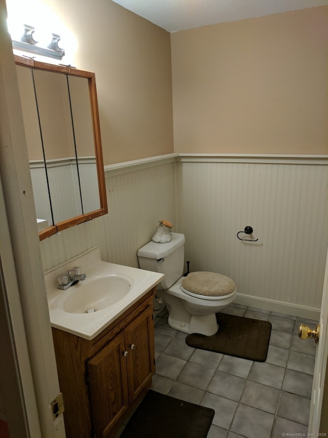 32 Anton Rd Apt C, Mansfield, CT 06268 - half bathroom featuring vanity, wainscoting, toilet, and tile patterned floors
