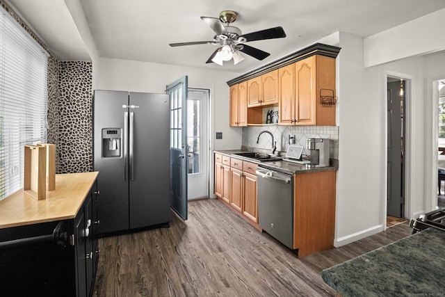 104 Bay Ave, New Britain, CT 06053 - kitchen with stainless steel appliances, a sink, a ceiling fan, dark wood-style flooring, and tasteful backsplash