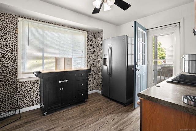 104 Bay Ave, New Britain, CT 06053 - kitchen featuring stainless steel fridge with ice dispenser, dark cabinetry, a ceiling fan, dark wood finished floors, and healthy amount of natural light