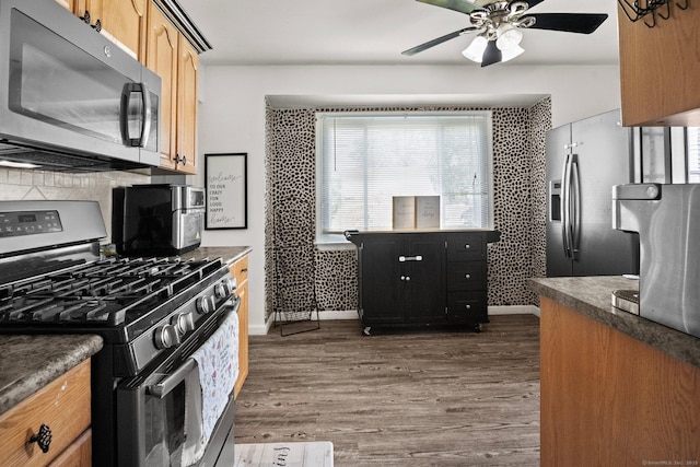 104 Bay Ave, New Britain, CT 06053 - kitchen with stainless steel appliances, plenty of natural light, wood finished floors, and ceiling fan