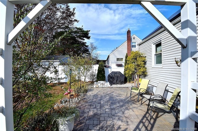 104 Bay Ave, New Britain, CT 06053 - fenced backyard featuring a patio area and a grill