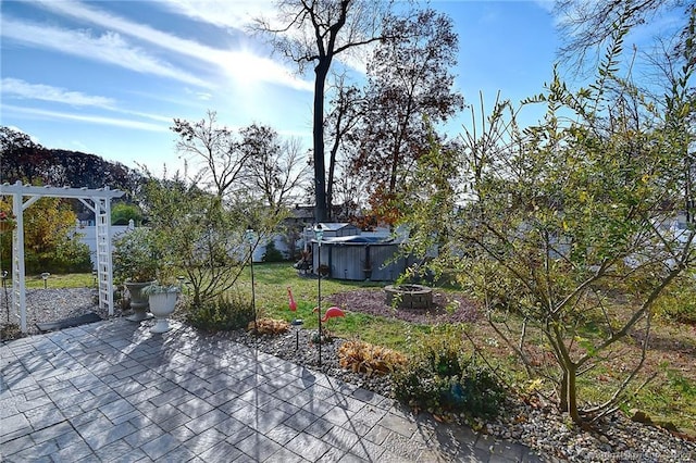 104 Bay Ave, New Britain, CT 06053 - fenced backyard featuring a patio area, a pergola, and a jacuzzi
