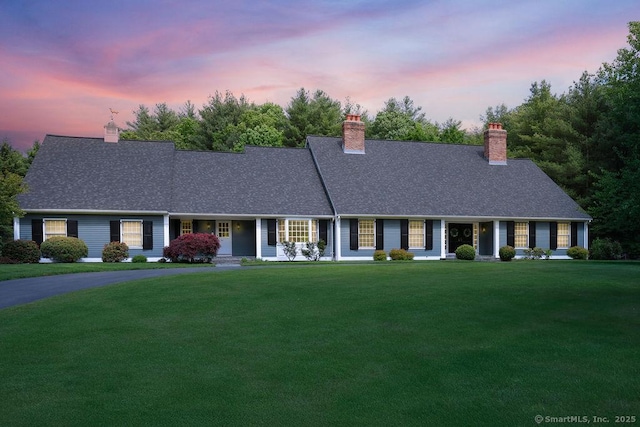 16 Oak Blf, Avon, CT 06001 - view of front facade with a chimney, a front yard, and a shingled roof