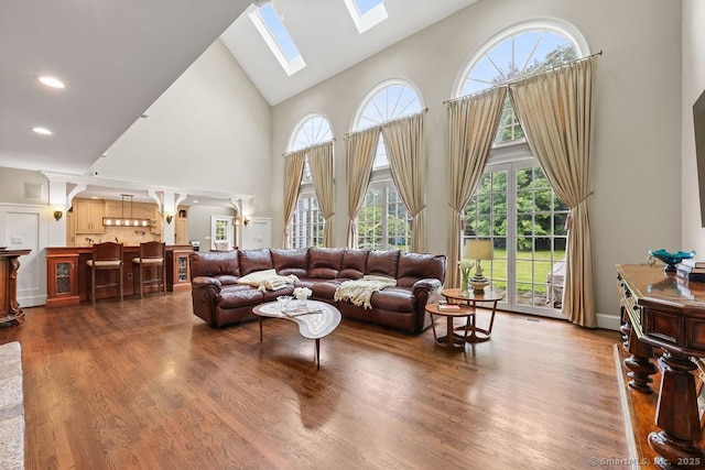 16 Oak Blf, Avon, CT 06001 - living area with high vaulted ceiling, a skylight, plenty of natural light, and dark wood-type flooring