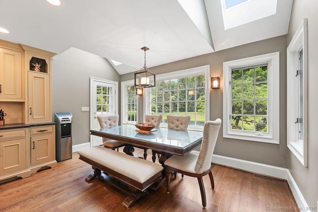 16 Oak Blf, Avon, CT 06001 - dining room featuring a skylight, vaulted ceiling, light wood-style flooring, recessed lighting, and a chandelier
