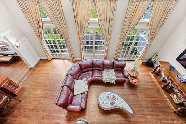 16 Oak Blf, Avon, CT 06001 - living room featuring a towering ceiling, plenty of natural light, and wood finished floors