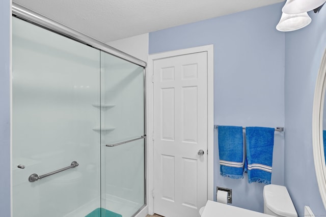 24 Farmington Chase Cres, Farmington, CT 06032 - bathroom featuring toilet, a stall shower, and a textured ceiling