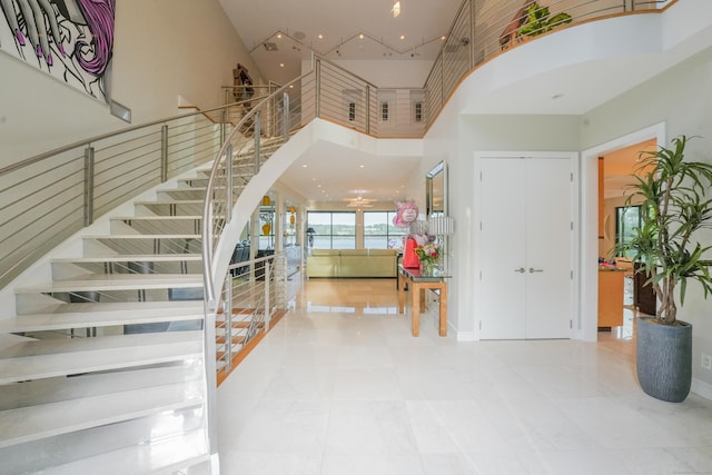 5050 Main St, Stratford, CT 06614 - foyer with a towering ceiling, stairway, and a water view