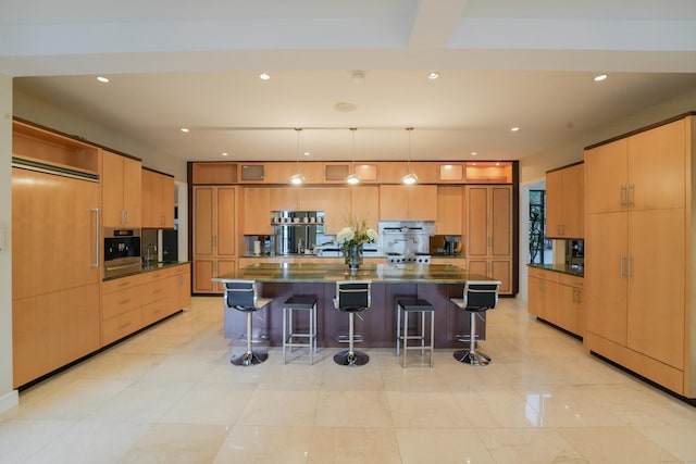 5050 Main St, Stratford, CT 06614 - kitchen with a large island, a breakfast bar area, modern cabinets, recessed lighting, and pendant lighting