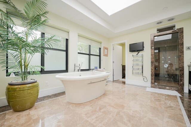 5050 Main St, Stratford, CT 06614 - full bath featuring a stall shower, a freestanding bath, and baseboards
