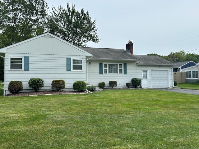 50 Pauline St, Milford, CT 06460 - view of front facade featuring a garage, driveway, a chimney, and a front yard