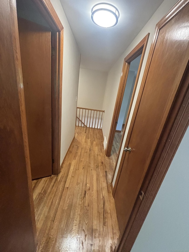 33 Hillsdale Dr, Ellington, CT 06029 - corridor featuring light wood-style floors and an upstairs landing