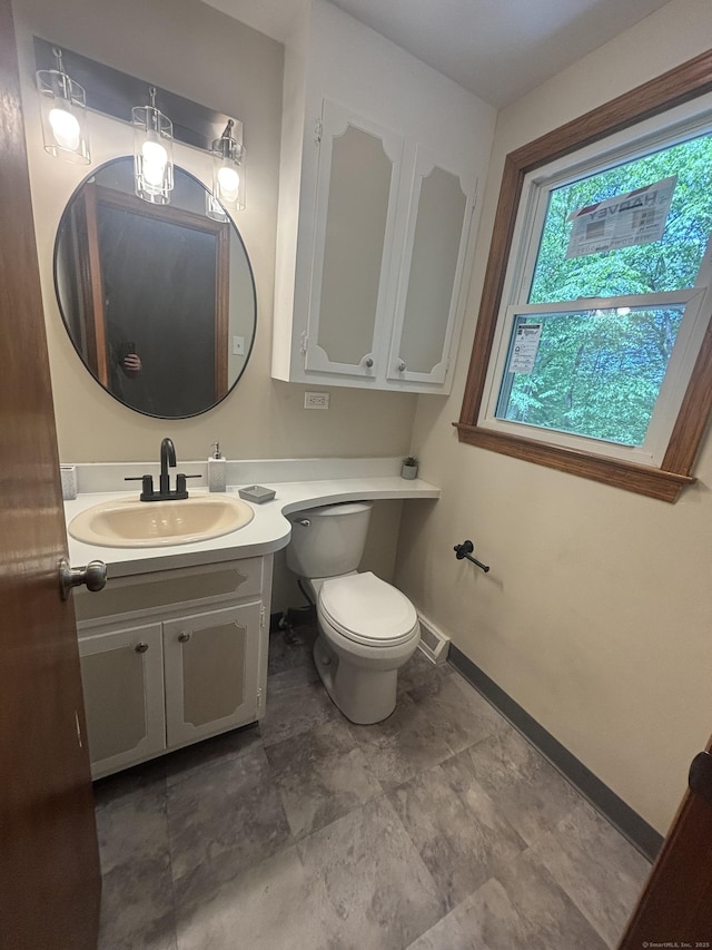 33 Hillsdale Dr, Ellington, CT 06029 - bathroom featuring vanity, toilet, and baseboards