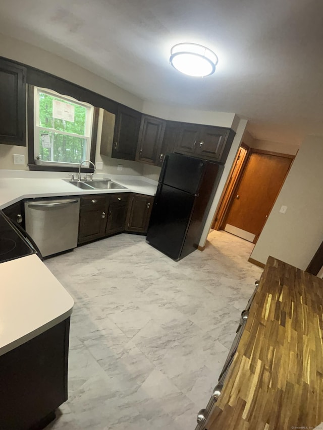 33 Hillsdale Dr, Ellington, CT 06029 - kitchen with a sink, stainless steel dishwasher, freestanding refrigerator, and light countertops