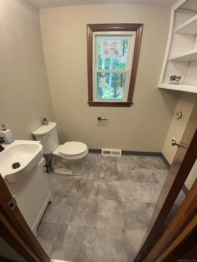 33 Hillsdale Dr, Ellington, CT 06029 - half bathroom featuring vanity, toilet, and baseboards