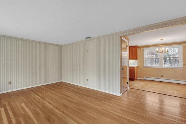 192 Hilton Dr, South Windsor, CT 06074 - unfurnished room with baseboard heating, a chandelier, light wood-style floors, and baseboards