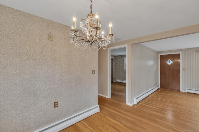 192 Hilton Dr, South Windsor, CT 06074 - unfurnished dining area featuring baseboard heating, a chandelier, light wood-style flooring, baseboards, and a baseboard radiator