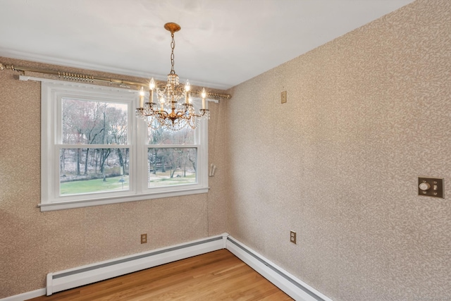 192 Hilton Dr, South Windsor, CT 06074 - unfurnished dining area featuring a chandelier, light wood finished floors, baseboards, and a baseboard radiator