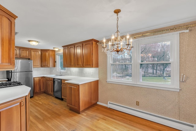 192 Hilton Dr, South Windsor, CT 06074 - kitchen featuring a baseboard radiator, dishwasher, brown cabinets, light countertops, and a sink