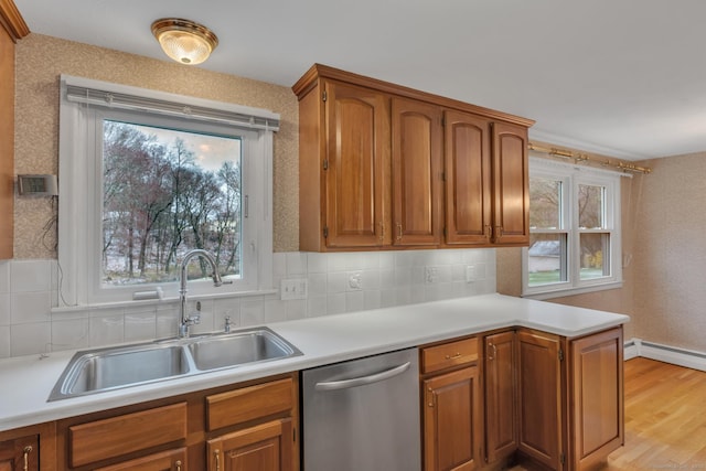 192 Hilton Dr, South Windsor, CT 06074 - kitchen featuring dishwasher, a sink, light countertops, and healthy amount of natural light