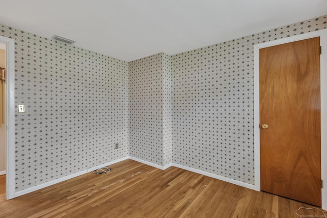 192 Hilton Dr, South Windsor, CT 06074 - empty room featuring wallpapered walls, baseboards, and light wood-style floors