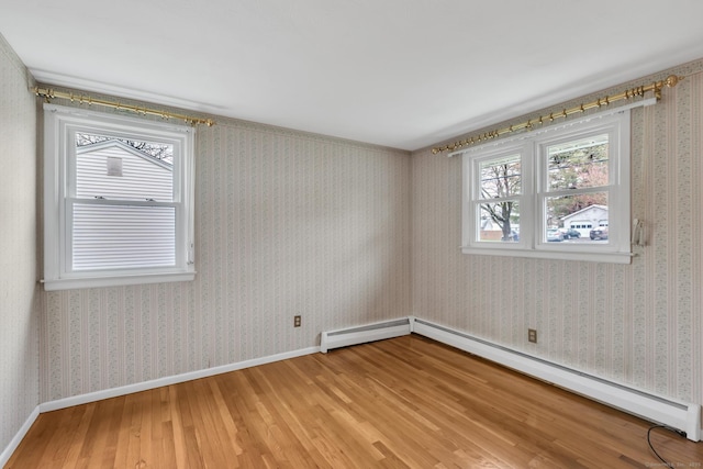 192 Hilton Dr, South Windsor, CT 06074 - spare room featuring light wood finished floors, a baseboard heating unit, baseboard heating, and baseboards
