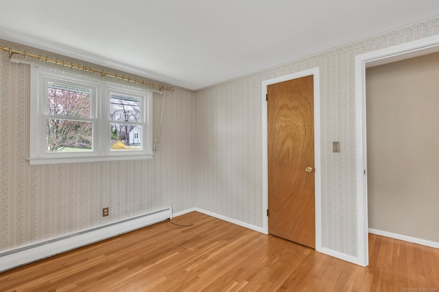 192 Hilton Dr, South Windsor, CT 06074 - unfurnished bedroom featuring baseboard heating, light wood finished floors, and baseboards