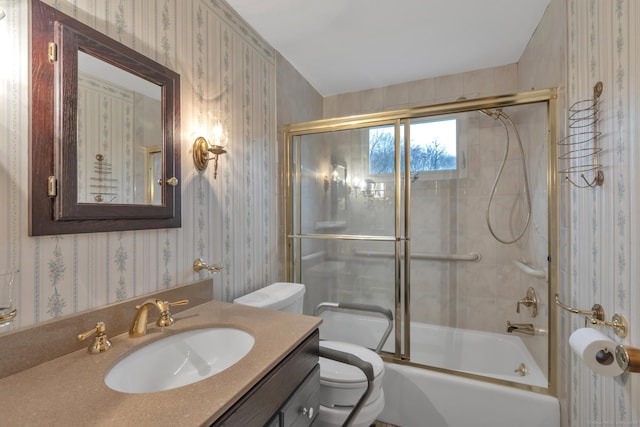 192 Hilton Dr, South Windsor, CT 06074 - full bathroom with wallpapered walls, toilet, vanity, and bath / shower combo with glass door