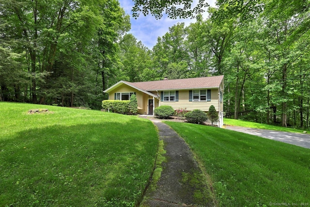 9 Honey Ln, Newtown, CT 06482 - ranch-style home featuring a front lawn and a wooded view
