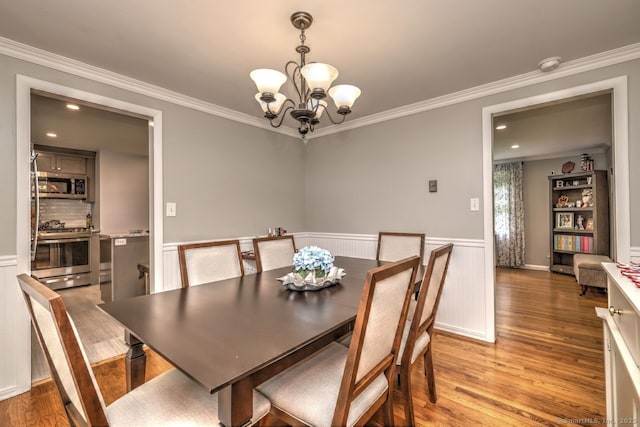 9 Honey Ln, Newtown, CT 06482 - dining room with a chandelier, crown molding, light wood-type flooring, wainscoting, and recessed lighting