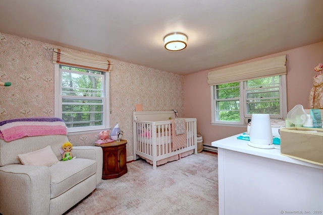 9 Honey Ln, Newtown, CT 06482 - bedroom with wallpapered walls, a crib, light carpet, and baseboard heating