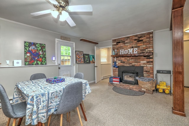 9 Honey Ln, Newtown, CT 06482 - carpeted dining area featuring ornamental molding, a wood stove, a baseboard radiator, a ceiling fan, and baseboards