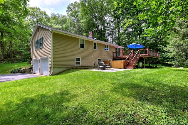 9 Honey Ln, Newtown, CT 06482 - back of house with a wooden deck, stairs, a garage, asphalt driveway, and a yard