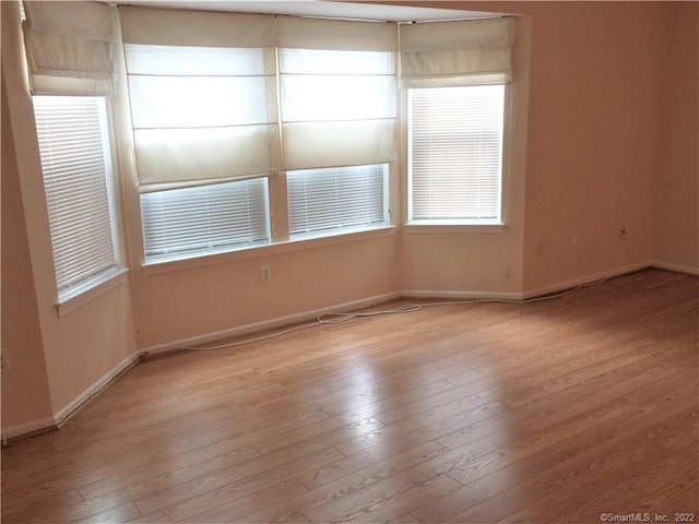 18 Greenview Ln Unit 18, Milford, CT 06461 - unfurnished room featuring baseboards and light wood finished floors