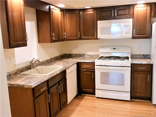 18 Greenview Ln Unit 18, Milford, CT 06461 - kitchen featuring white appliances and light wood-style floors