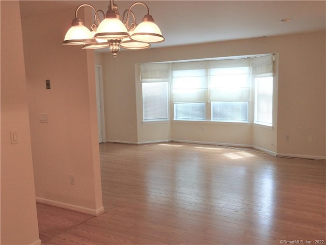 18 Greenview Ln Unit 18, Milford, CT 06461 - unfurnished room with wood finished floors and a chandelier