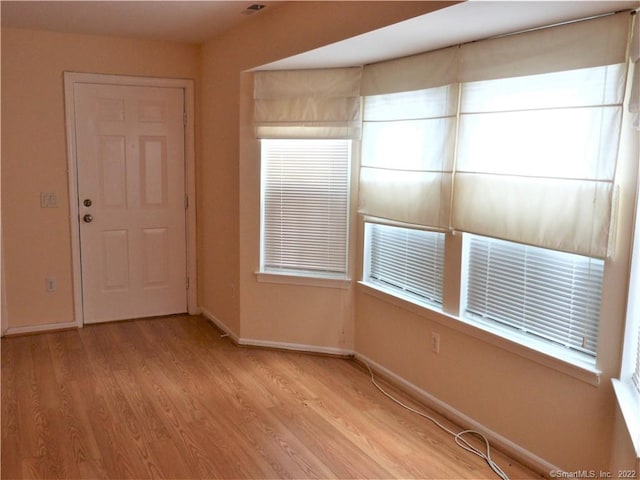 18 Greenview Ln Unit 18, Milford, CT 06461 - unfurnished room with light wood-style floors and baseboards