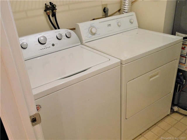 18 Greenview Ln Unit 18, Milford, CT 06461 - laundry area featuring independent washer and dryer and light tile patterned floors