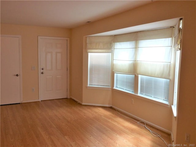 18 Greenview Ln Unit 18, Milford, CT 06461 - unfurnished room featuring light wood-style flooring and healthy amount of natural light
